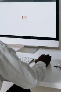 Person accessing Gmail on an computer representing an email hack scenario